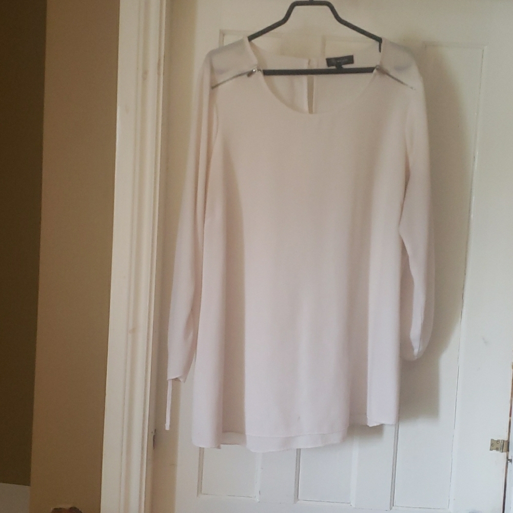 White blouse with zippers on both shoulders